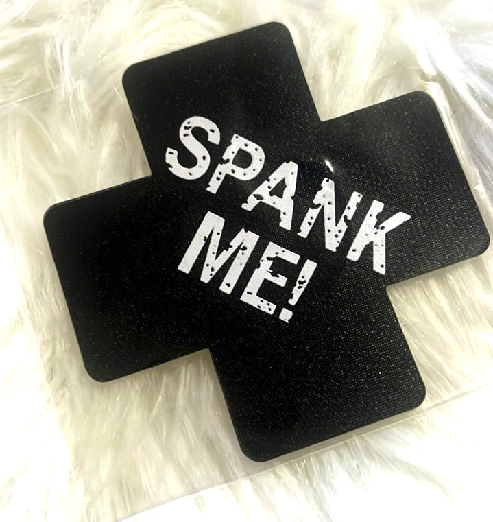 “Spank me” cross nipple covers