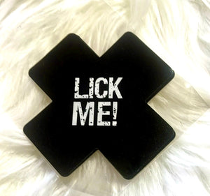 “Lick me” cross nipple covers